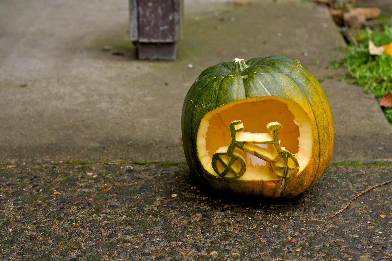 A pumpkin with a bike carved in it.